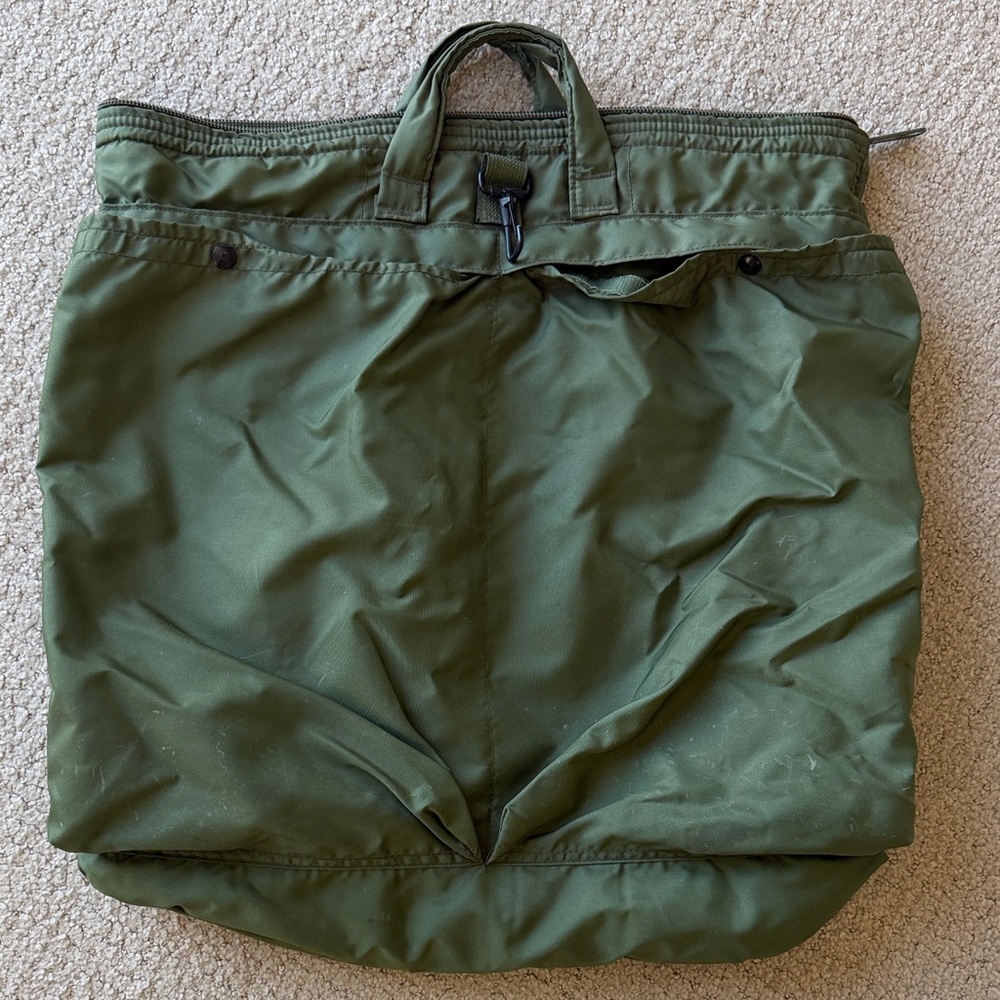 US Army issued vintage Flyer’s Helmet Bag. Army green color; zip top